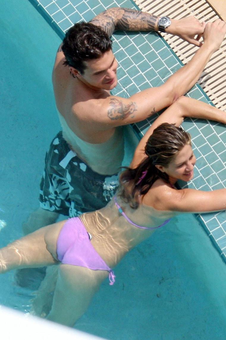 Amateur couple having fun at pool