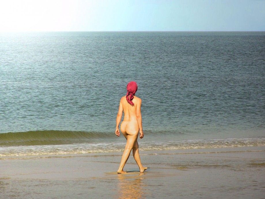 Nude walk on empty beach