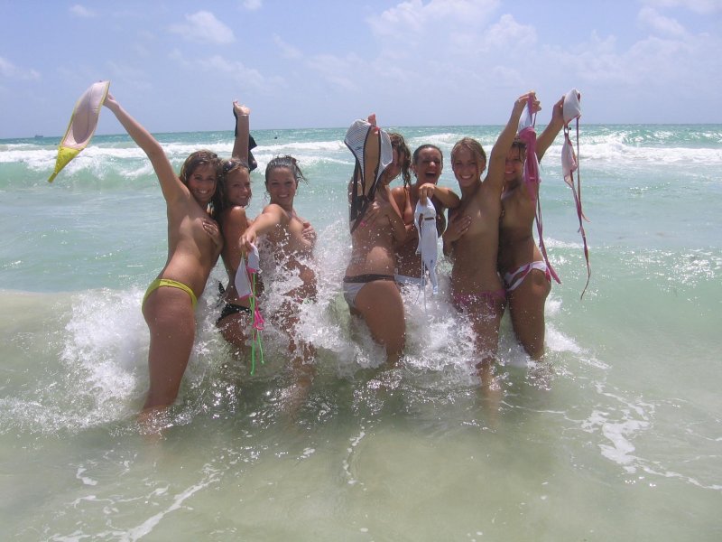 Group of sexy teens flashing everyone on the beach