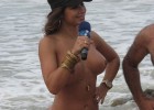 Nude babe playing as reporter at the beach