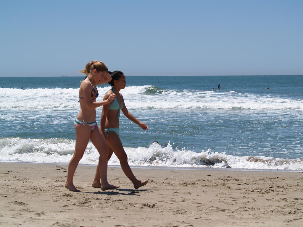 Hot chicks walking on the beach