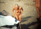 Nude girl exposed by voyeurs walking on the beach