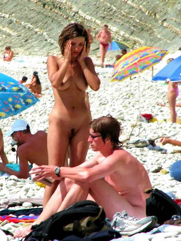 Nudist couple preparing for tanning