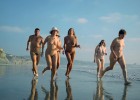 Running nude and wild on an empty beach