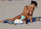 Topless babe reveal her hanging boobs on the beach
