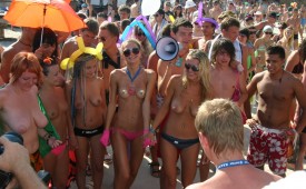 385-Horny-crowd-getting-in-touch-with-topless-cute-babes.jpg