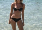 Blonde sweetie in black bikini