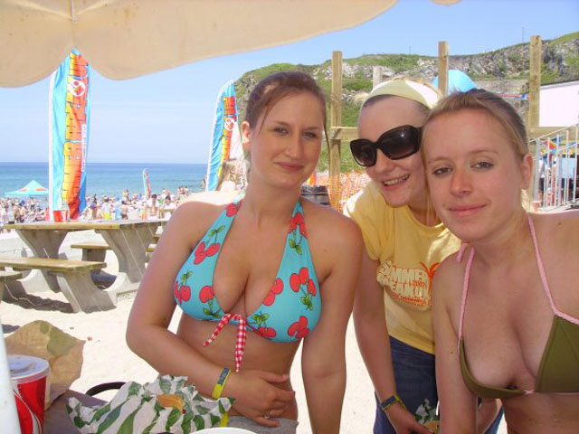 Three cuties taking candid beach pics